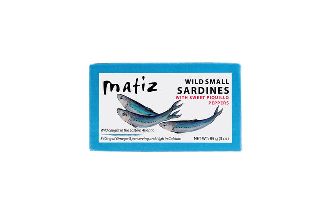 Matiz Wild Small Sardines with Sweet Piquillo Peppers on a neutral background.