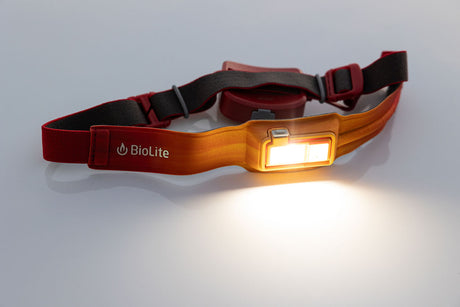 BioLite HeadLamp 425 in Ember Yellow lit on a neutral background.