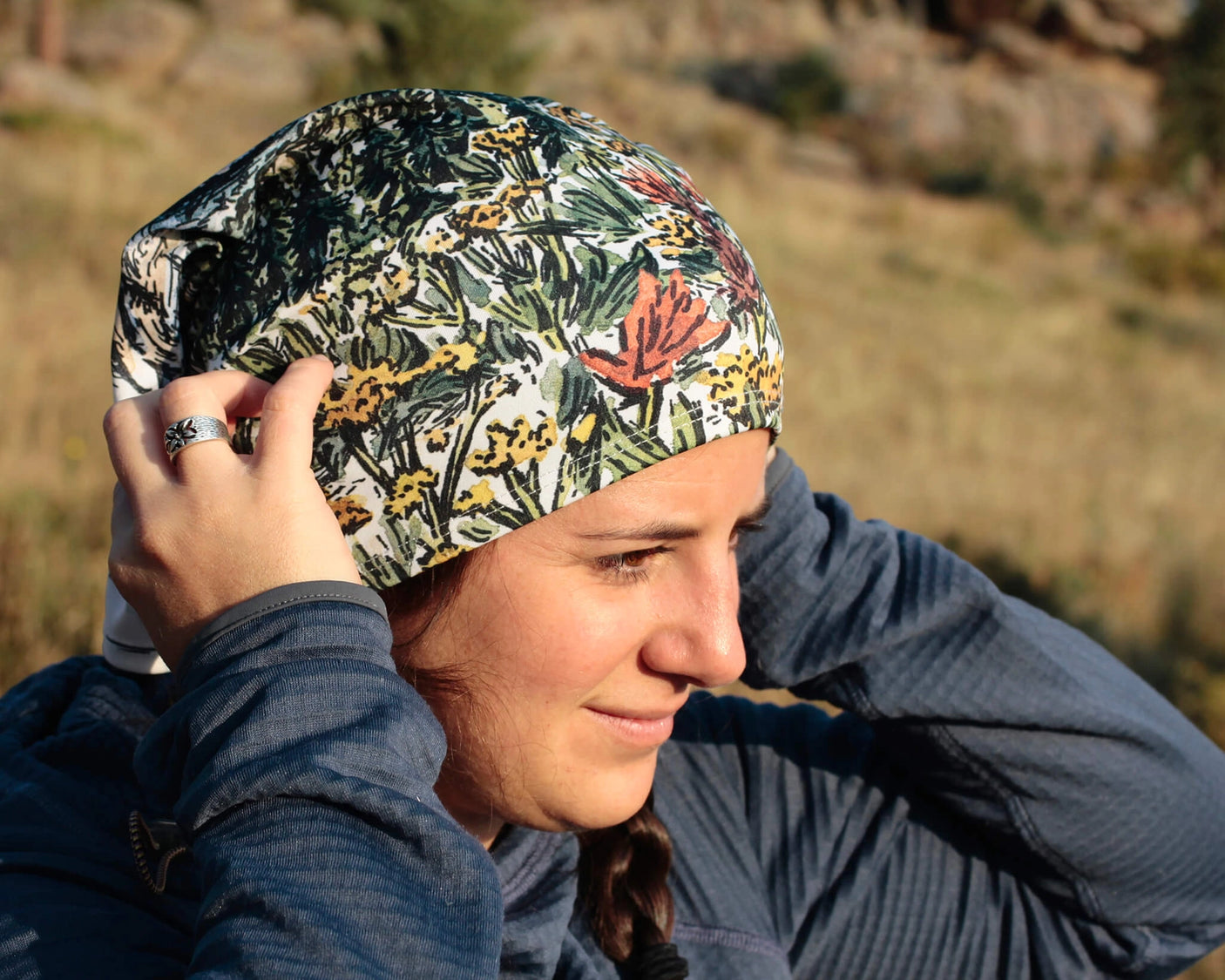 Alpinecho's Neck Gaiter being worn by a woman outside.