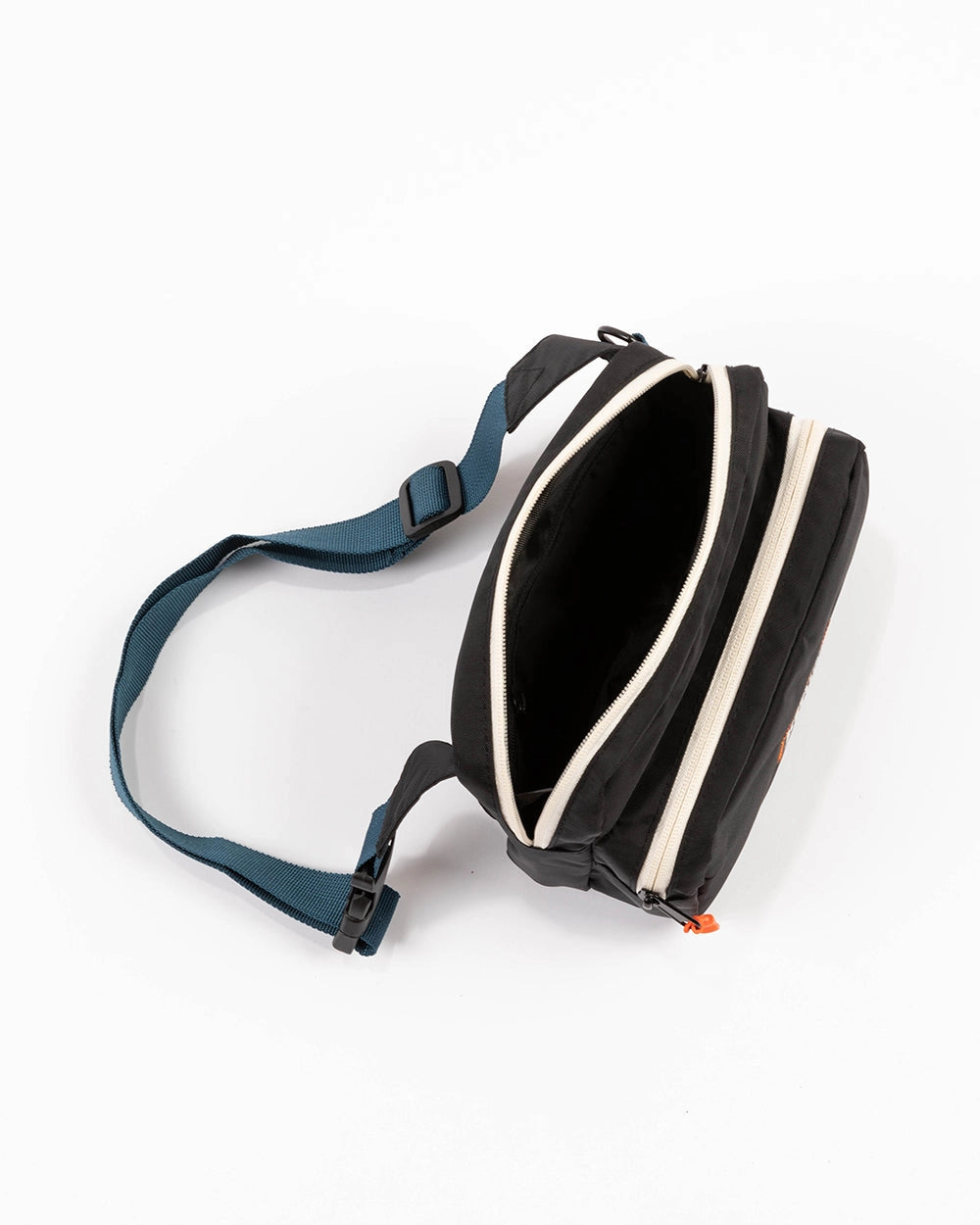 KNW Fanny Pack on a neutral background from above, showing the interior.