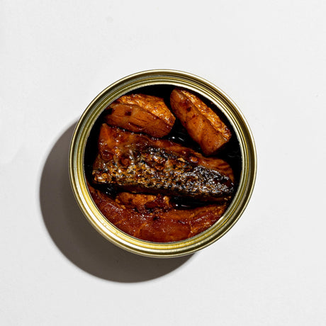 Fishwife Smoked Salmon with Fly By Jing Sichuan Chili Crisp tinned fish contents on a neutral background.