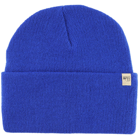 Minus33 Everyday Knit Cuff Merino Wool Beanie in Royal Blue on a neutral background.