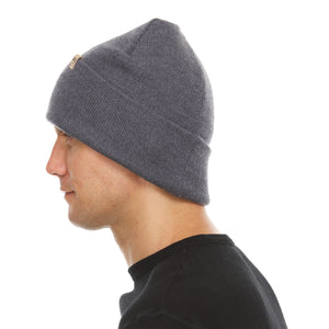 Minus33 Everyday Knit Cuff Merino Wool Beanie in Charcoal Gray being worn on a neutral background.