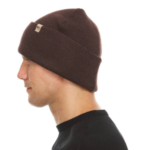 Minus33 Everyday Knit Cuff Merino Wool Beanie worn by a man and viewed from the side.