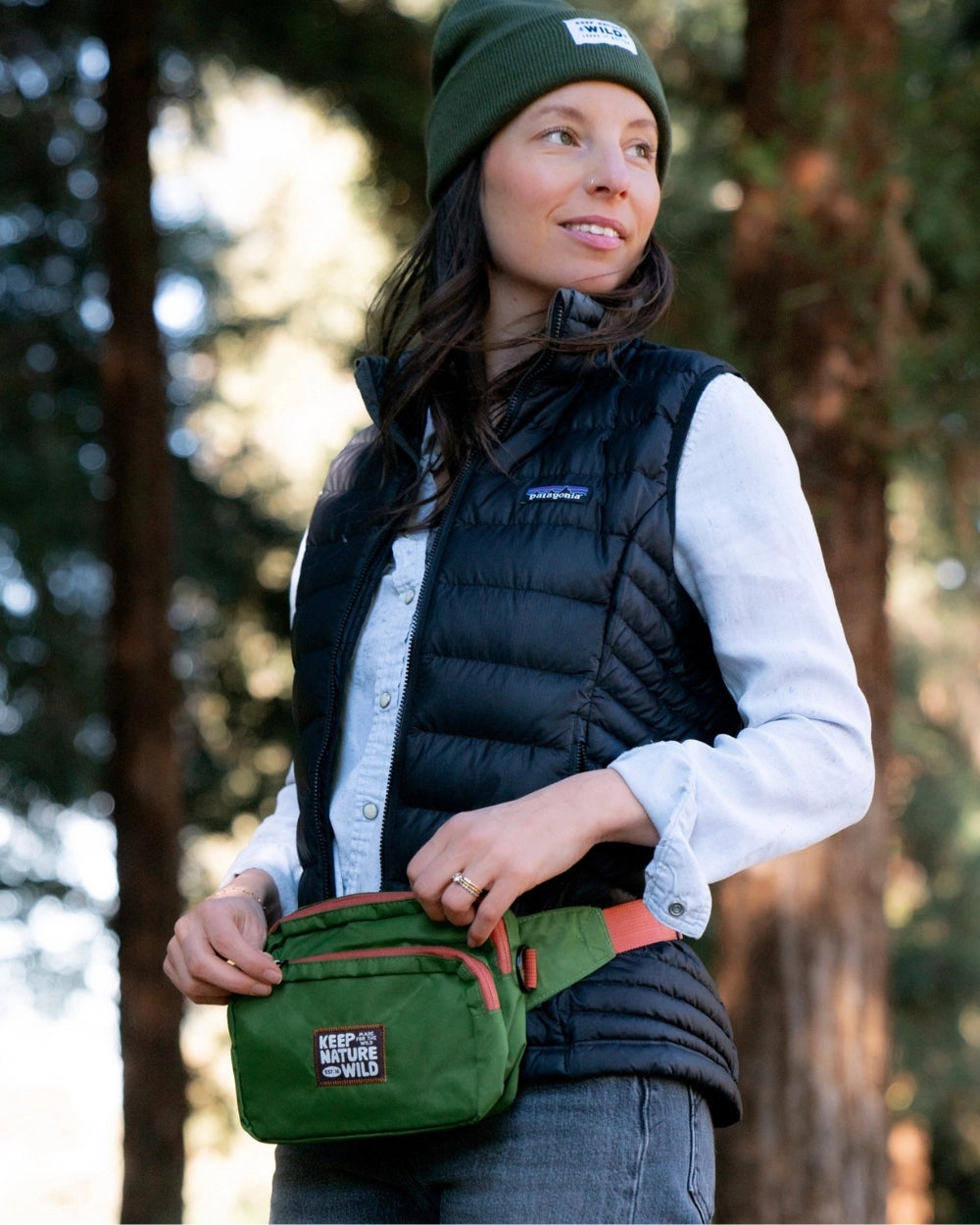 Keep Nature Wild Fanny Pack worn by a woman in the woods.