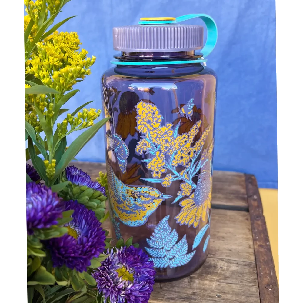 Mustard Beetle 32oz Nalgene bottle with the Prairie Warbler design, featuring a bird and flowers on a lavender colored Nalgene bottle.