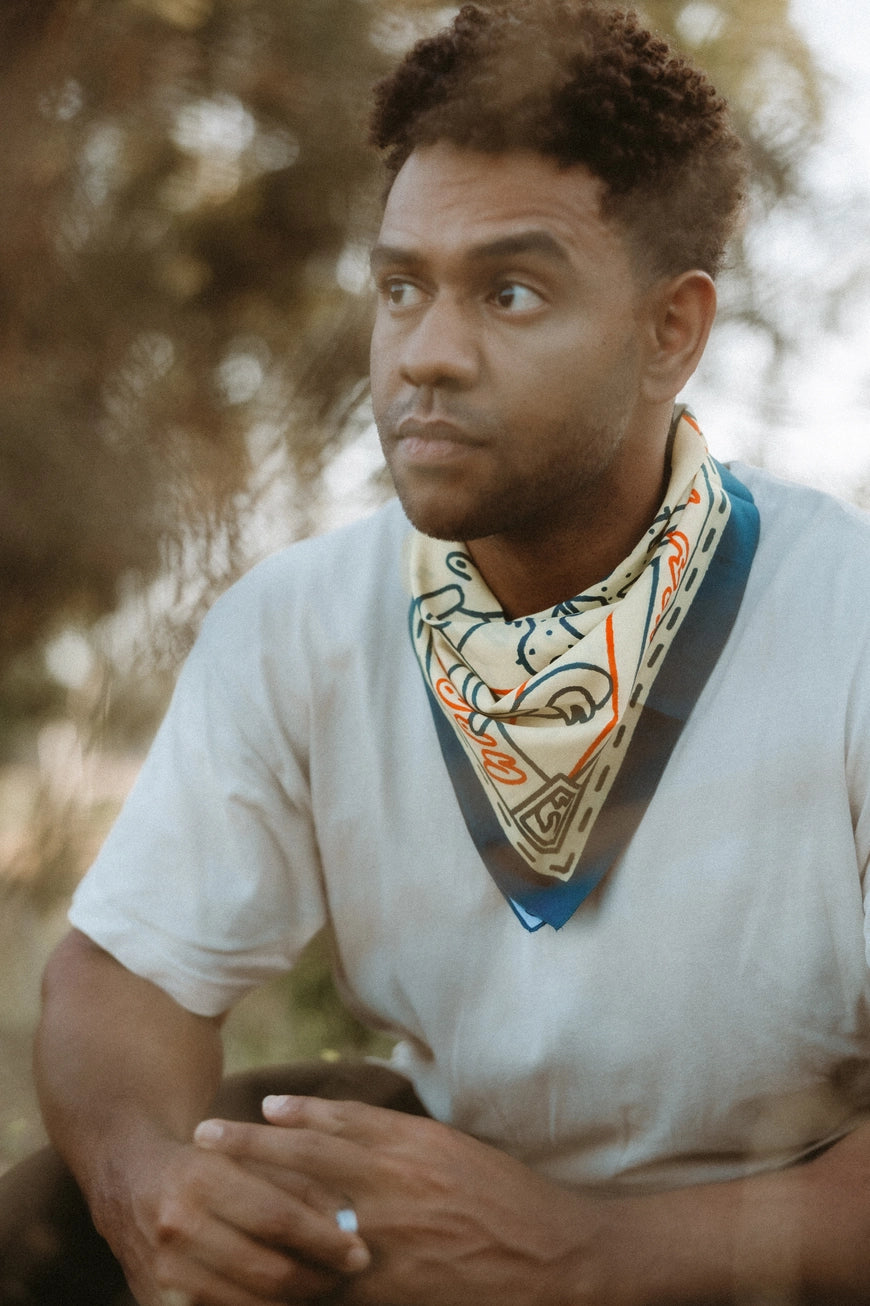 Bandits Grab The Horns bandana worn by a man outdoors.