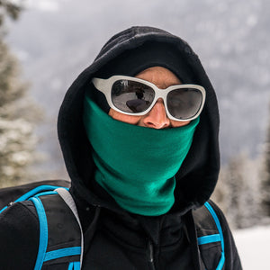 Minus33 Midweight - Neck Gaiter 100% Merino Wool in Emerald Green being worn outdoors.