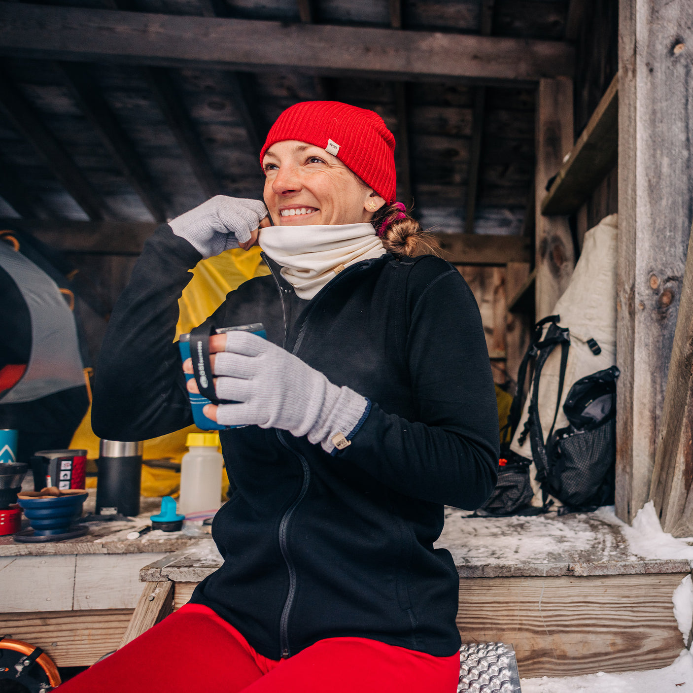 Minus33 Midweight Merino Wool Neck Gaiter worn by a woman outdoors in cold weather.