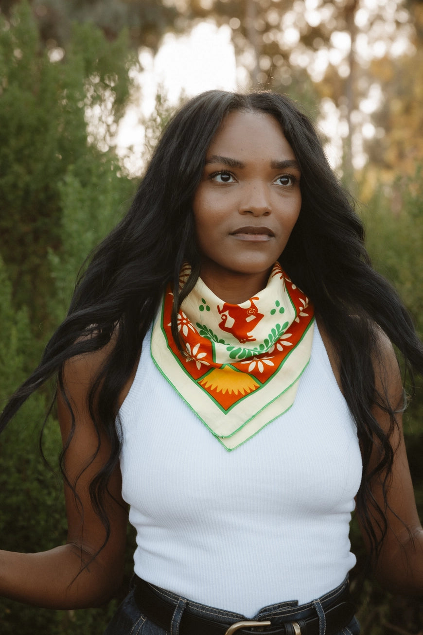 Bandits La Magia De Tochtli Bandana worn by a woman outdoors.