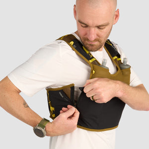 Ultimate Direction Xodus Vest in Fig Green being worn from the side on a neutral background.