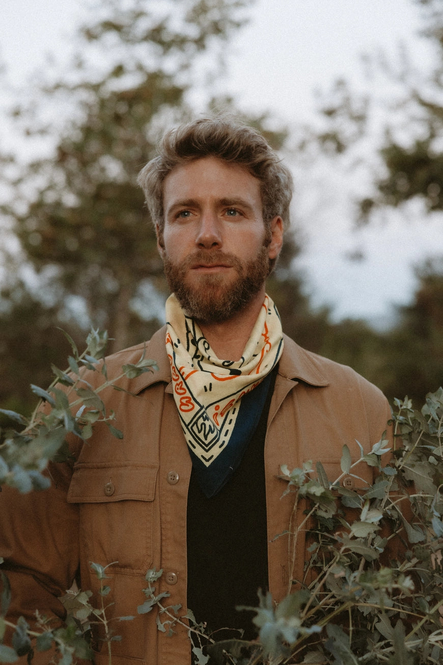 Bandits Grab The Horns bandana worn by a man outdoors.