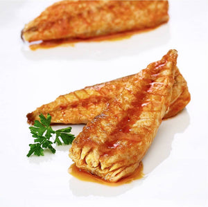 La Narval Mackerel Fillets in Tomato Sauce on a white plate with a sprig of parsley