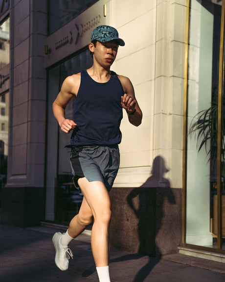 Ciele Athletics GOCap SC Field Loopy MU running hat in Dusty Turquoise worn by a runner outdoors.
