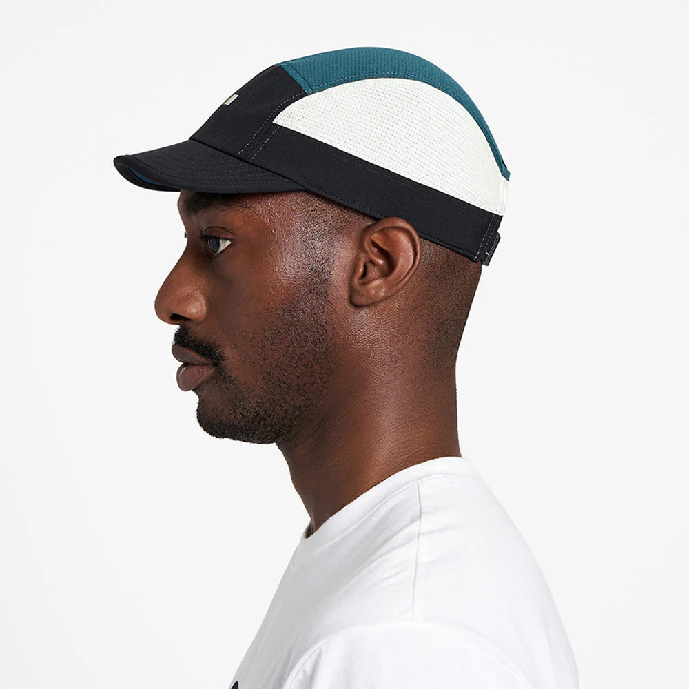 Ciele Athletics ALZCap - Horizon in Indifar worn by a man on a neutral background from the side.
