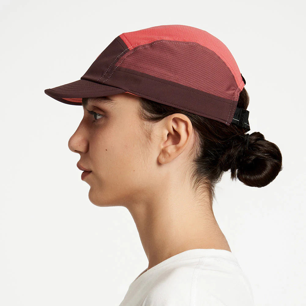 Ciele Athletics ALZCap - in Willow worn by a woman on a neutral background from the side.