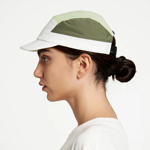 Ciele Athletics ALZCap - in Willow worn by a woman on a neutral background from the side.