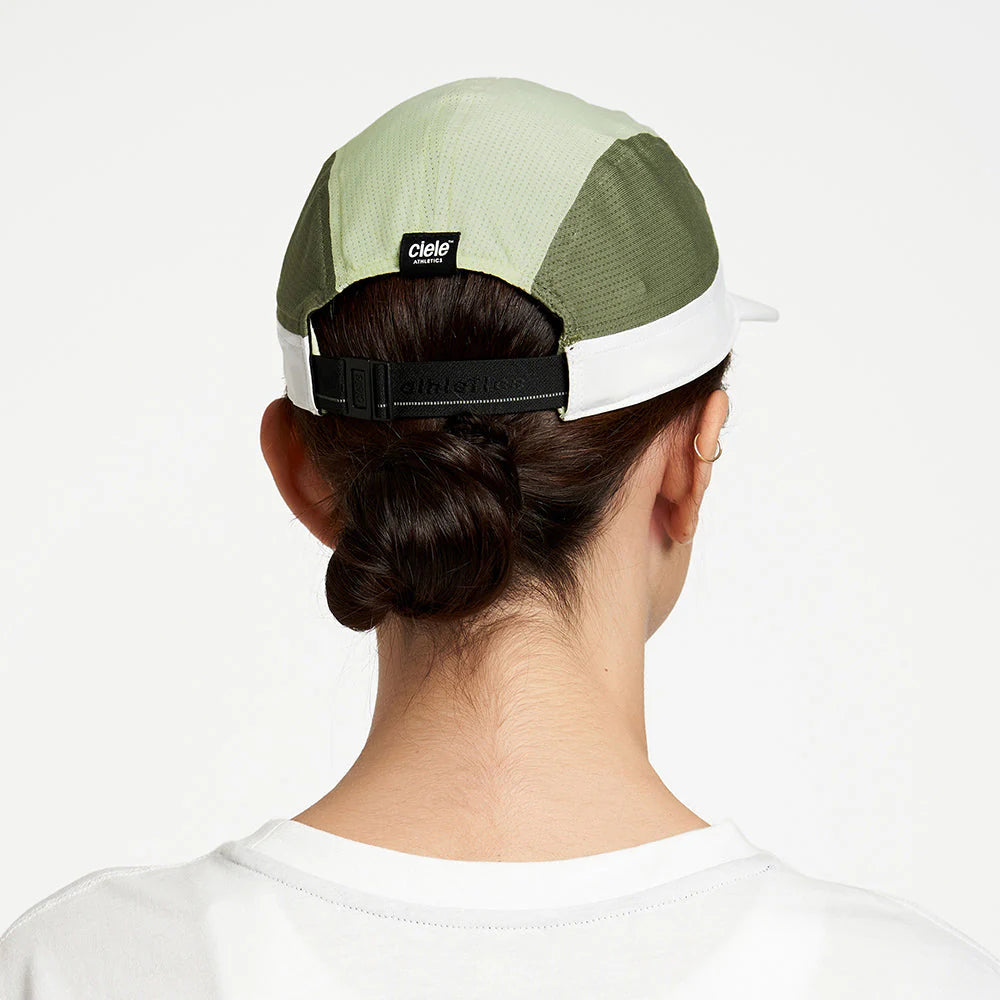 Ciele Athletics ALZCap - in Willow worn by a woman on a neutral background from the rear.