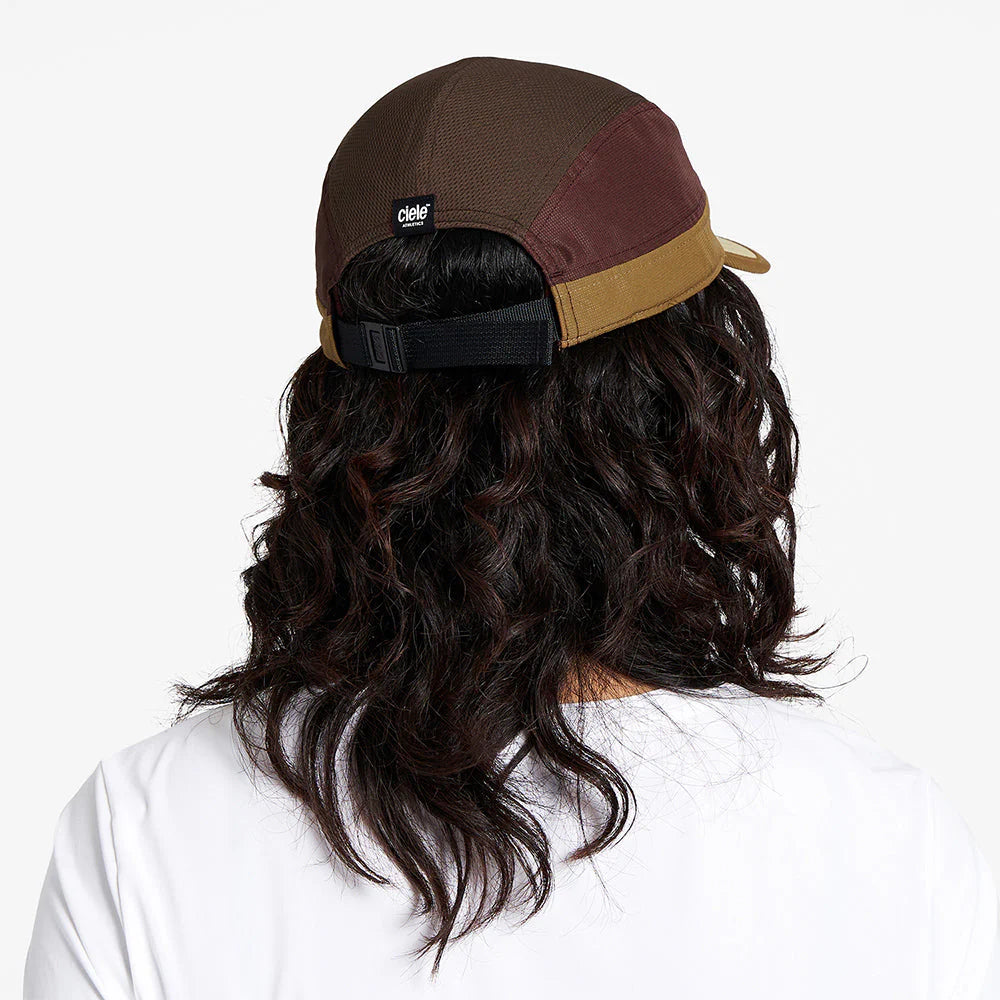 Ciele Athletics ALZCap SC in Arabica worn by a woman from the rear on a neutral background.