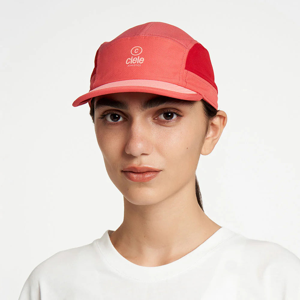 Ciele Athletics ALZCap SC in Topograph worn by a woman on a neutral background from the front.