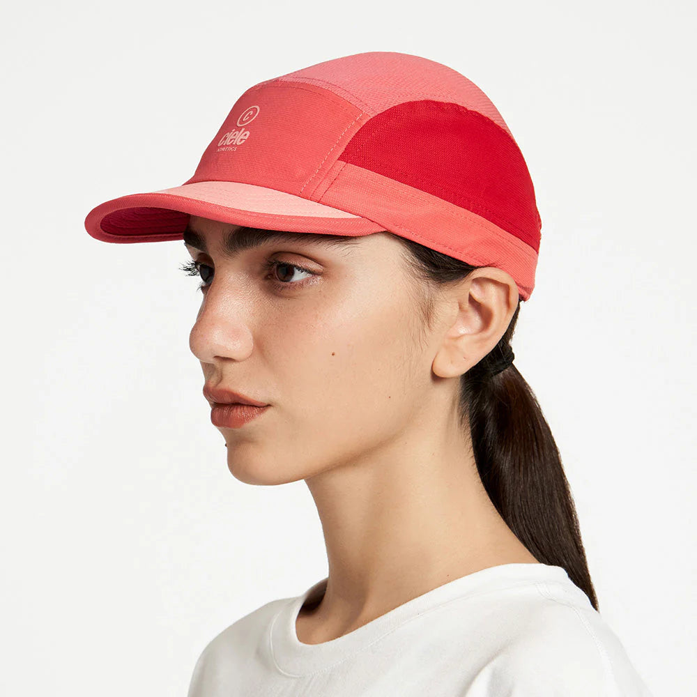 Ciele Athletics ALZCap SC in Topograph worn by a woman on a neutral background from the side.