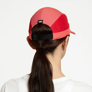 Ciele Athletics ALZCap SC in Topograph worn by a woman on a neutral background from the rear.