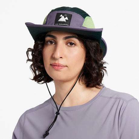 Ciele Athletics BNDCKHat Trail - Range cuts in Stormtaker worn by a woman from the front on a neutral background.