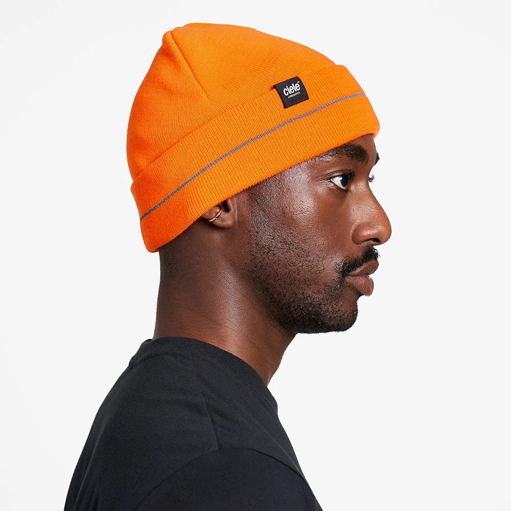 Ciele Athletics CR3Beanie trail running beanie in Spectro worn by a man from the side on a neutral background.