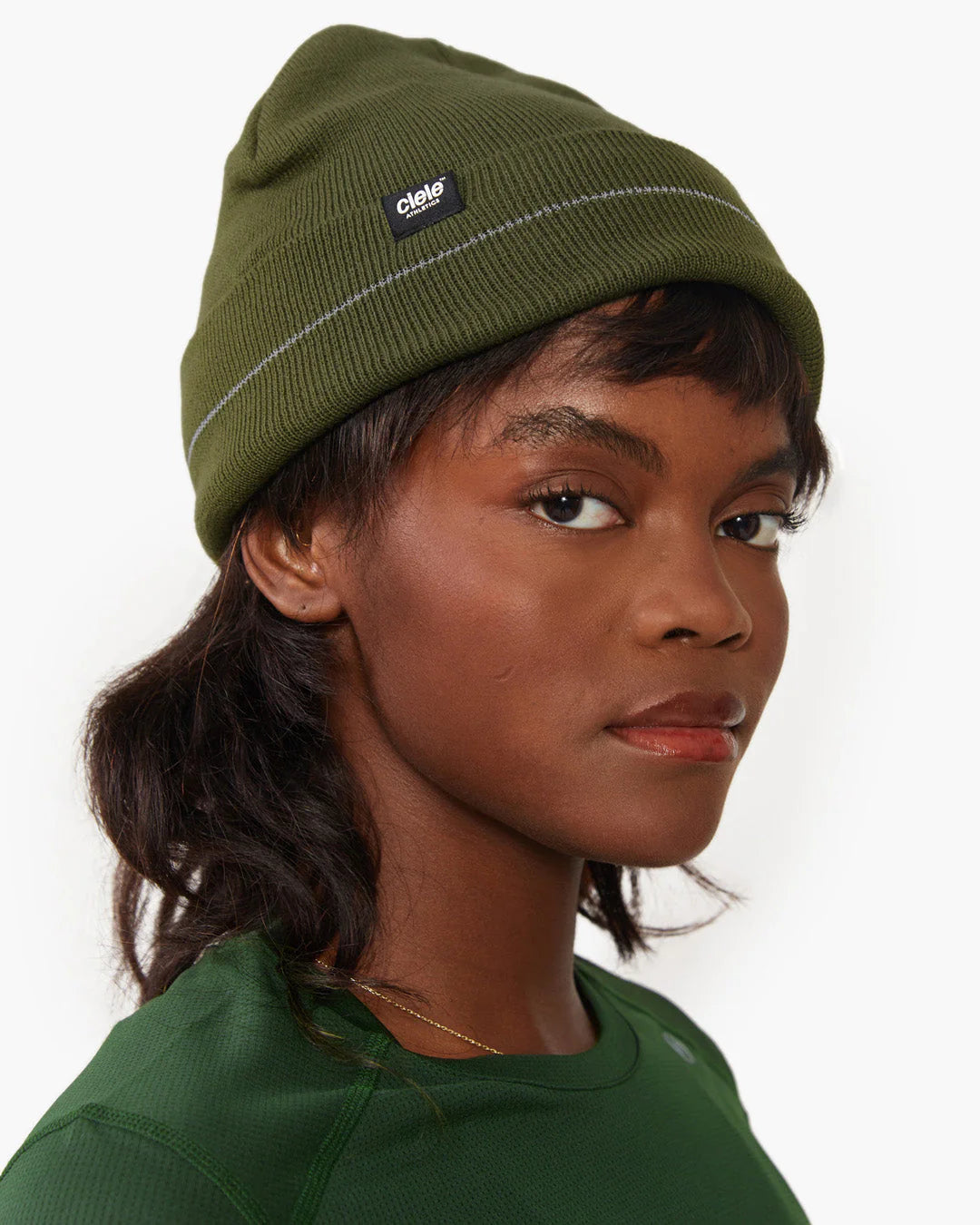 Ciele Athletics CR3Beanie in Boreal worn by a woman on a neutral background.