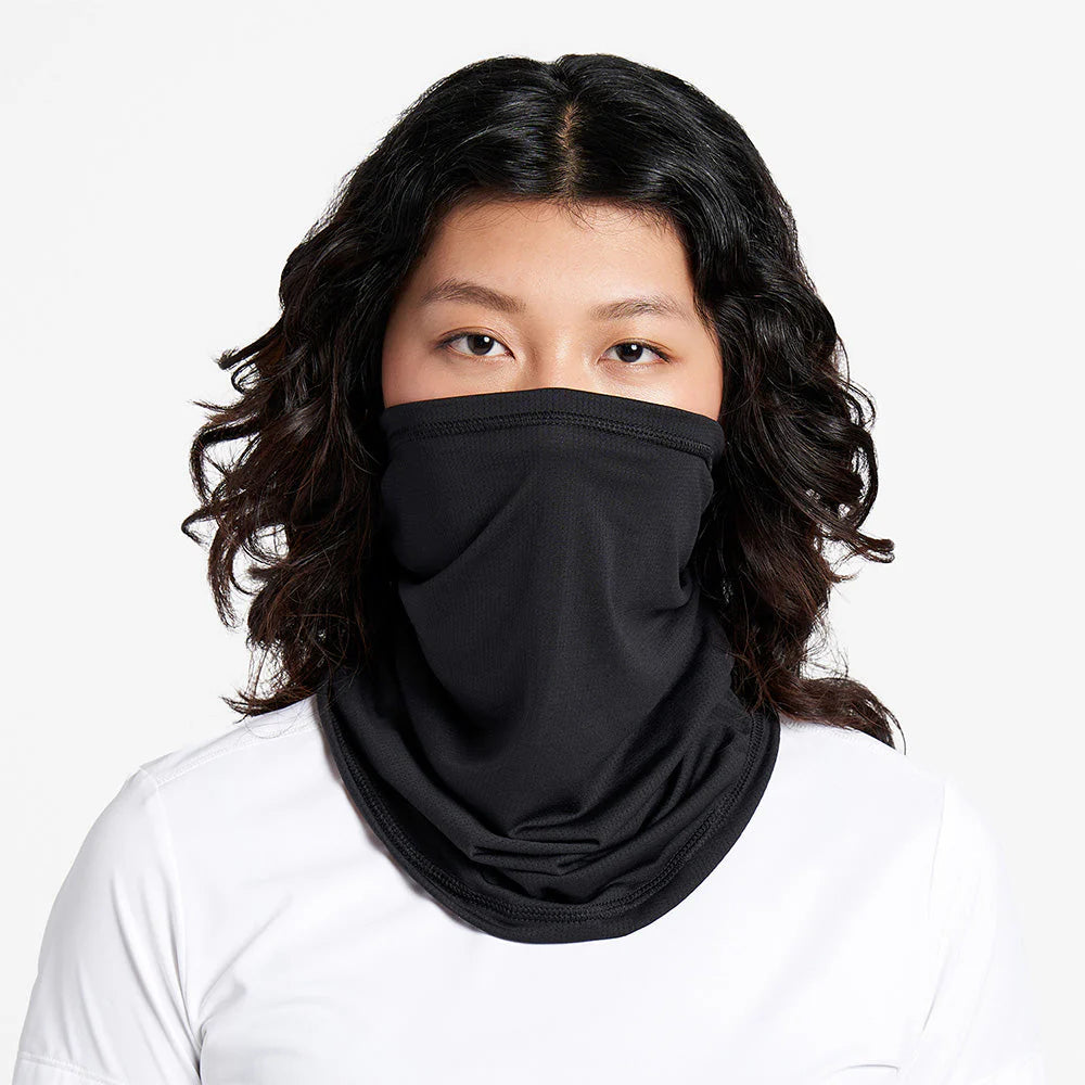 Ciele Athletics FSTCollar neck gaiter in Shadowcast worn by a woman from the front on a neutral background.