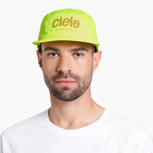 Ciele Athletics GOCap - Athletics in Polestar worn by a man on a neutral background.