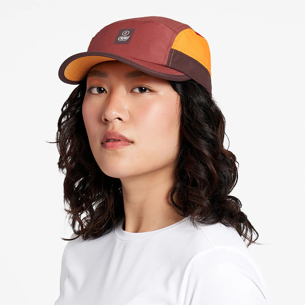 Ciele Athletics GOCap SC - C Plus Box in Rok Rouge worn by a woman on a neutral background.