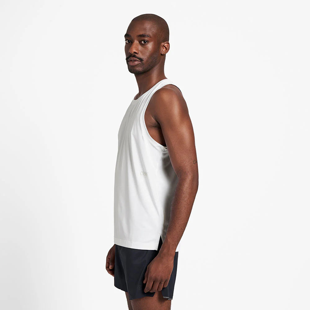 Ciele Athletics M DLYSinglet in Ghost worn by a man from the side on a neutral background.