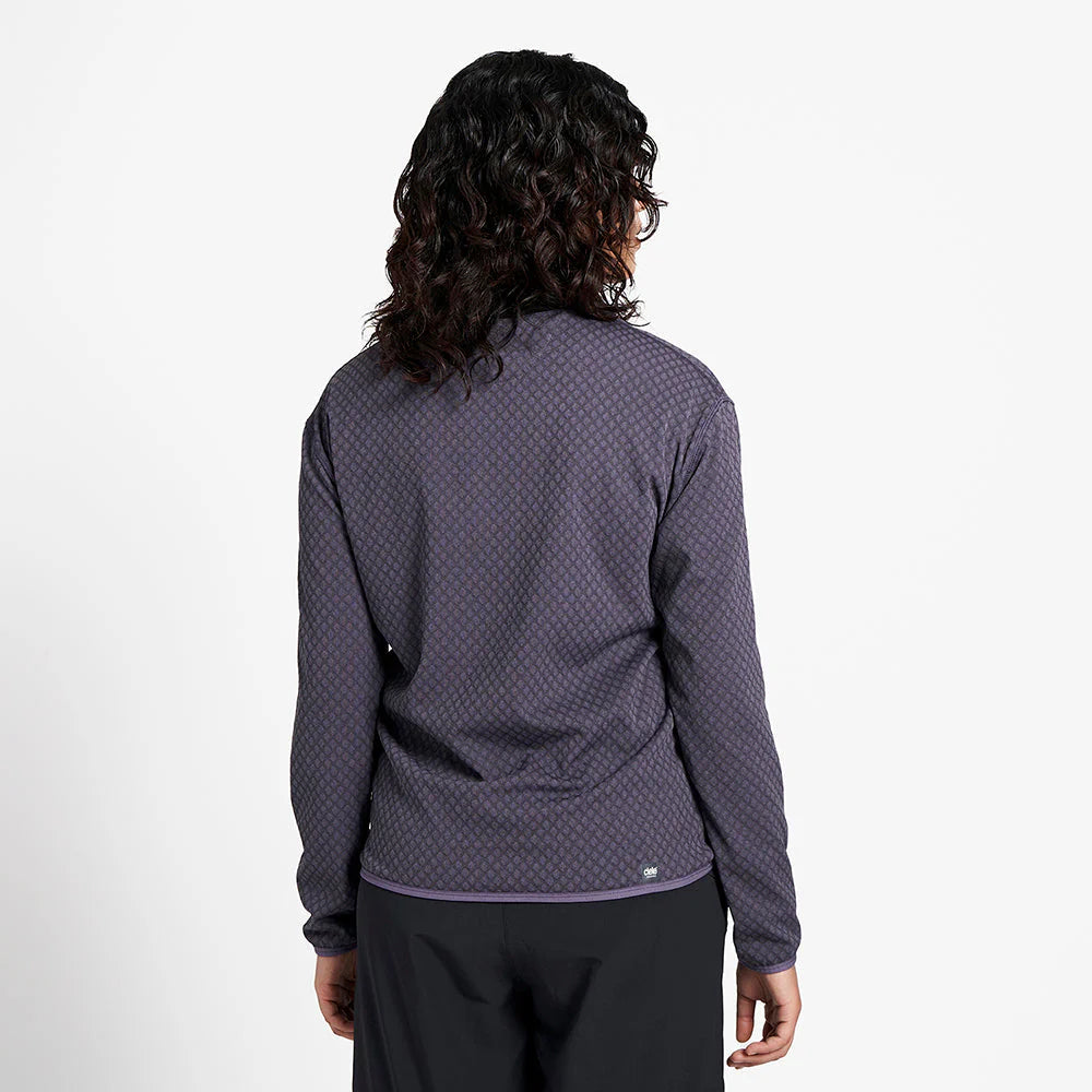 Ciele Athletics Unisex VLVMockneck cold weather running sweatshirt in Astronautic worn by a woman from the rear on a neutral background.