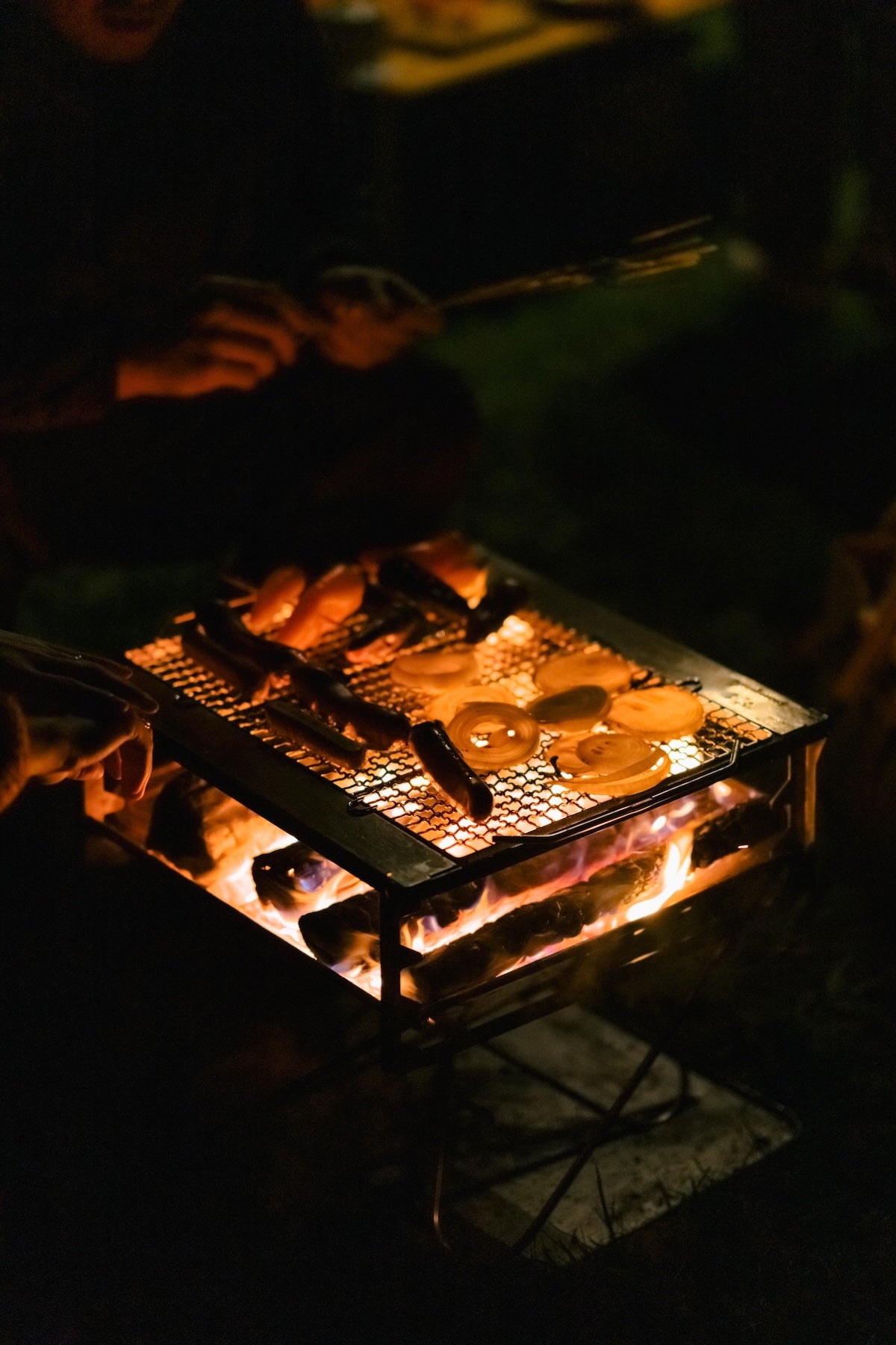 Takibi Fire & Grill Set camping fireplace being used outdoors.