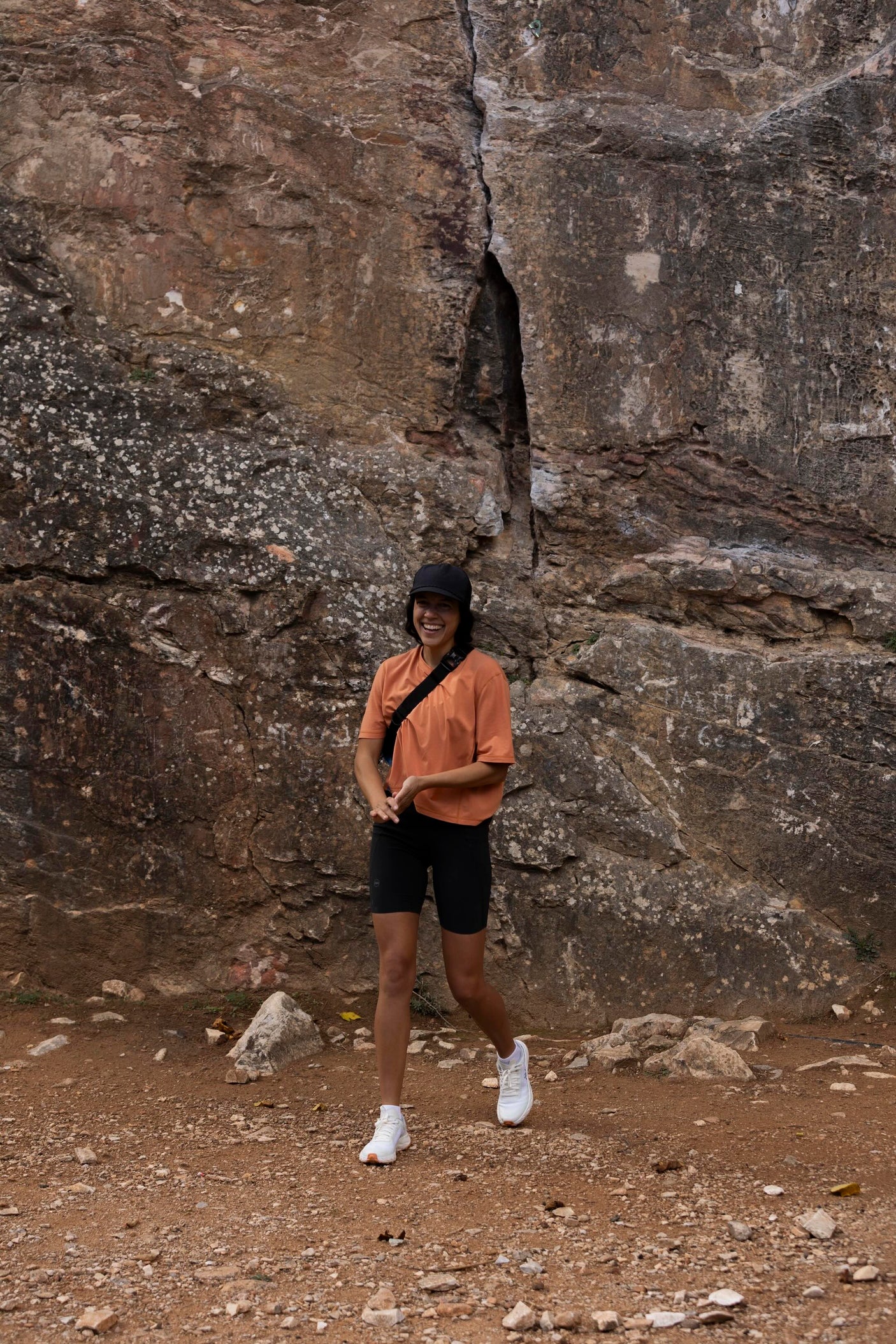 Janji's Circa Boxy Daily Tee in Amphora being worn by a woman outdoors.