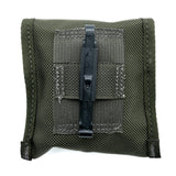 Green tactical pouch with a black clip on a white background