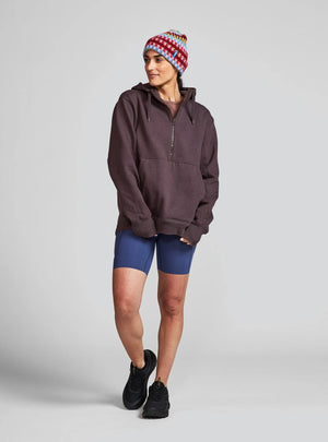 Janji Unisex Runaround Half-Zip Hoodie in Loam from the front being worn on a neutral background.