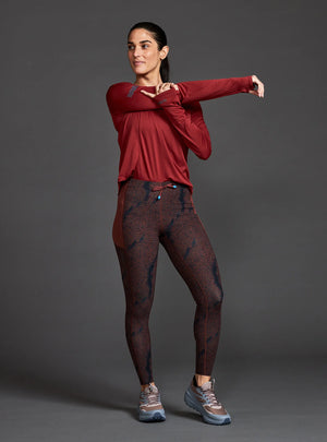 Janji's Women's 7/8 Trail Tight in Shadowlands worn by a woman from the front on a neutral background.