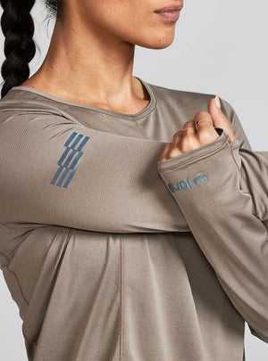 Janji W's Run All Day Long Sleeve in Silt worn by a woman up close on a neutral background.