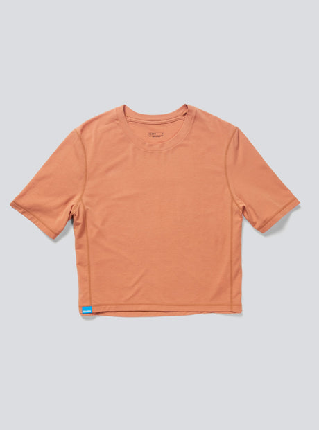 Janji's Circa Boxy Daily Tee in Amphora on a neutral background.
