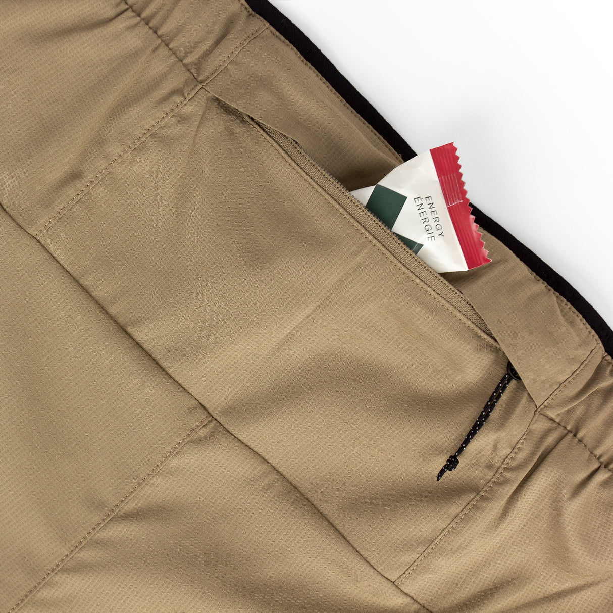 Close-up of Ciele Athletics Men's DLYShort 5" 2-in-1 Running Short in Canvas Beige pocket.