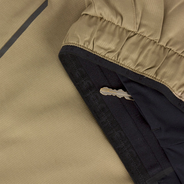 Close-up of Ciele Athletics Men's DLYShort 5" 2-in-1 Running Short in Canvas Beige hidden key pocket