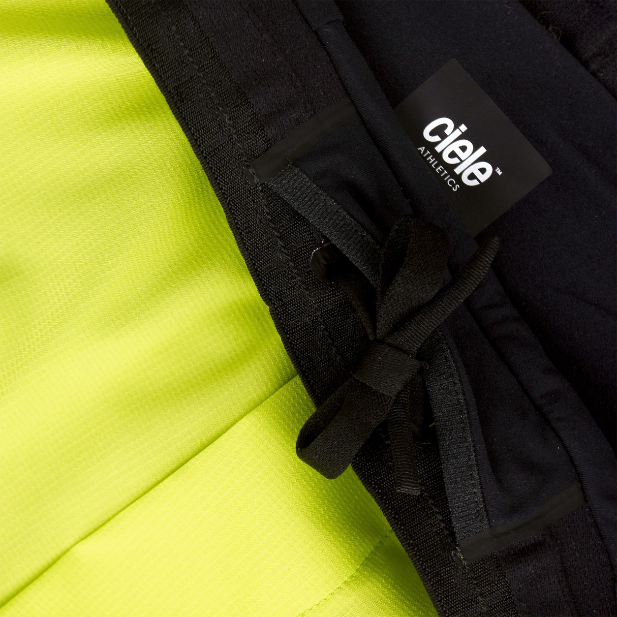 Close-up of a Ciele Athletics Men's DLYShort 5" 2-in-1 Running Short in Lime Green