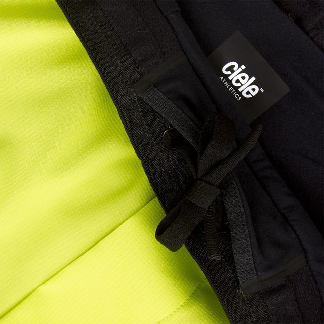 Close-up of a Ciele Athletics Men's DLYShort 5" 2-in-1 Running Short in Lime Green