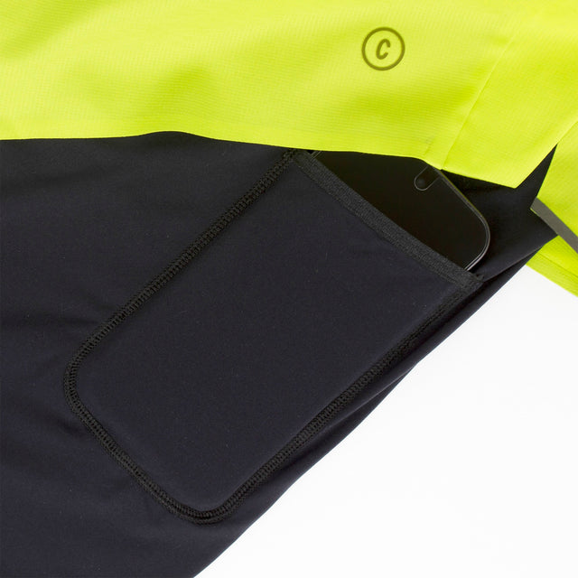 Ciele Athletics Men's DLYShort 5" 2-in-1 Running Short in Lime Green close-up of a black pocket with a brand logo.
