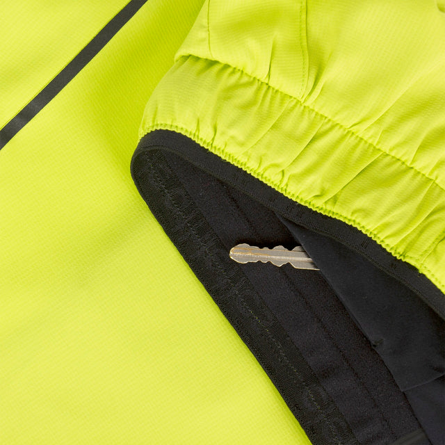 Close-up of a Ciele Athletics Men's DLYShort 5" 2-in-1 Running Short in Lime Green hidden key pocket