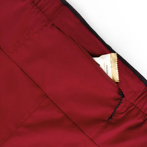Close-up of Ciele Athletics Men's DLYShort 5" 2-in-1 Running Short in Merlot Red pocket on a white background