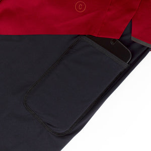 Close-up of Ciele Athletics Men's DLYShort 5" 2-in-1 Running Short in Merlot Red thigh pocket on a white background