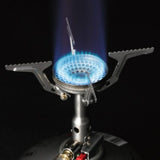 SOTO Amicus Stove with Igniter on a neutral background ignited to show the flame.